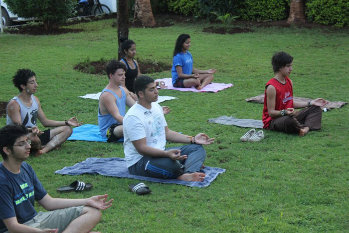 Students practicing Yoga. Students practicing Yoga.